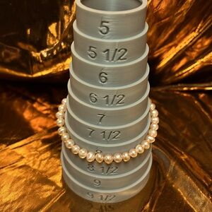 Pink miniature pearl with gold clasp. Great for debutant.